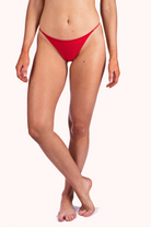 Model wearing NKD Bare Red String Thong Underwear for Women – front view