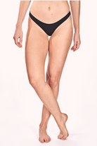 Model wearing NKD Classic Black Thong Underwear for Women – front view
